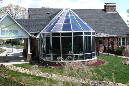 Exterior of segmented style conservatory / sunroom / solarium / swim-spa enclosure